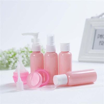 Tiny Royalty Cosmetic Bottling Set featuring various pink plastic bottles for beauty and cosmetic packaging.